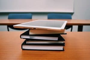 books and tablet in classroom